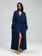 Woman in a royal blue long fleece robe