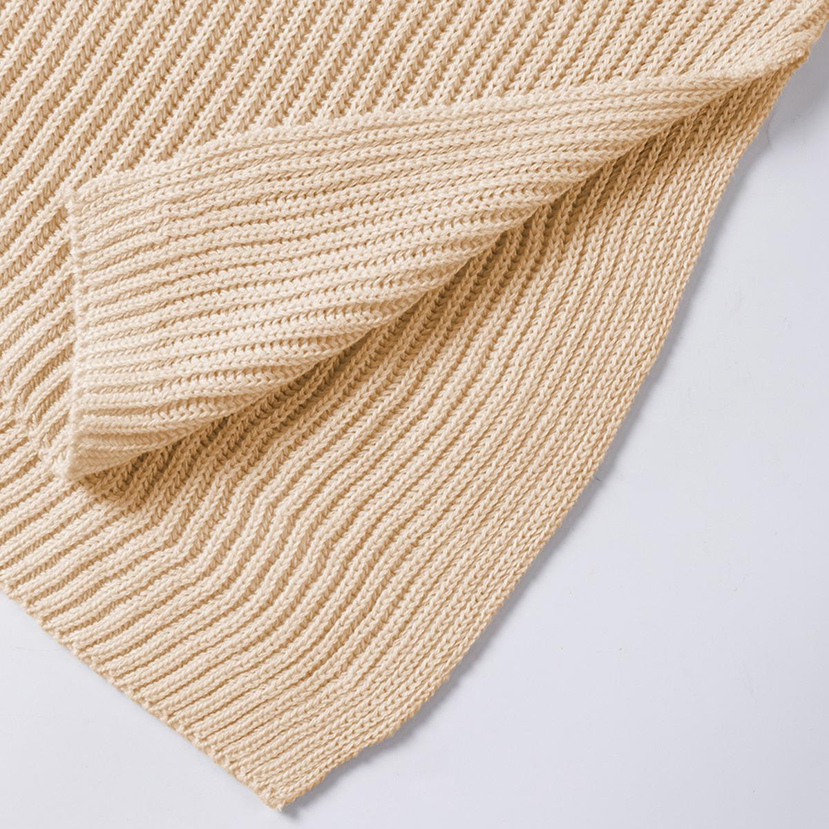 Close-up of the soft ribbed cotton knit and side slit hem