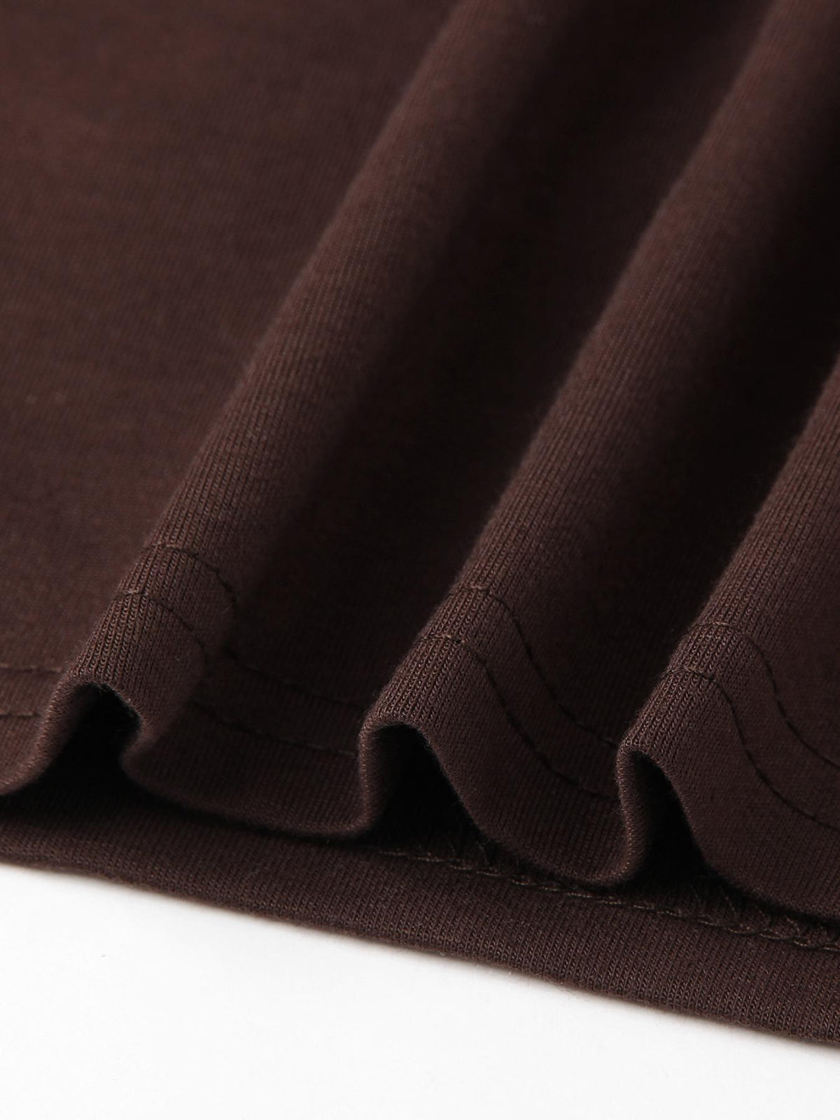 Close-up of the soft fabric drape on the wide-leg pant hem