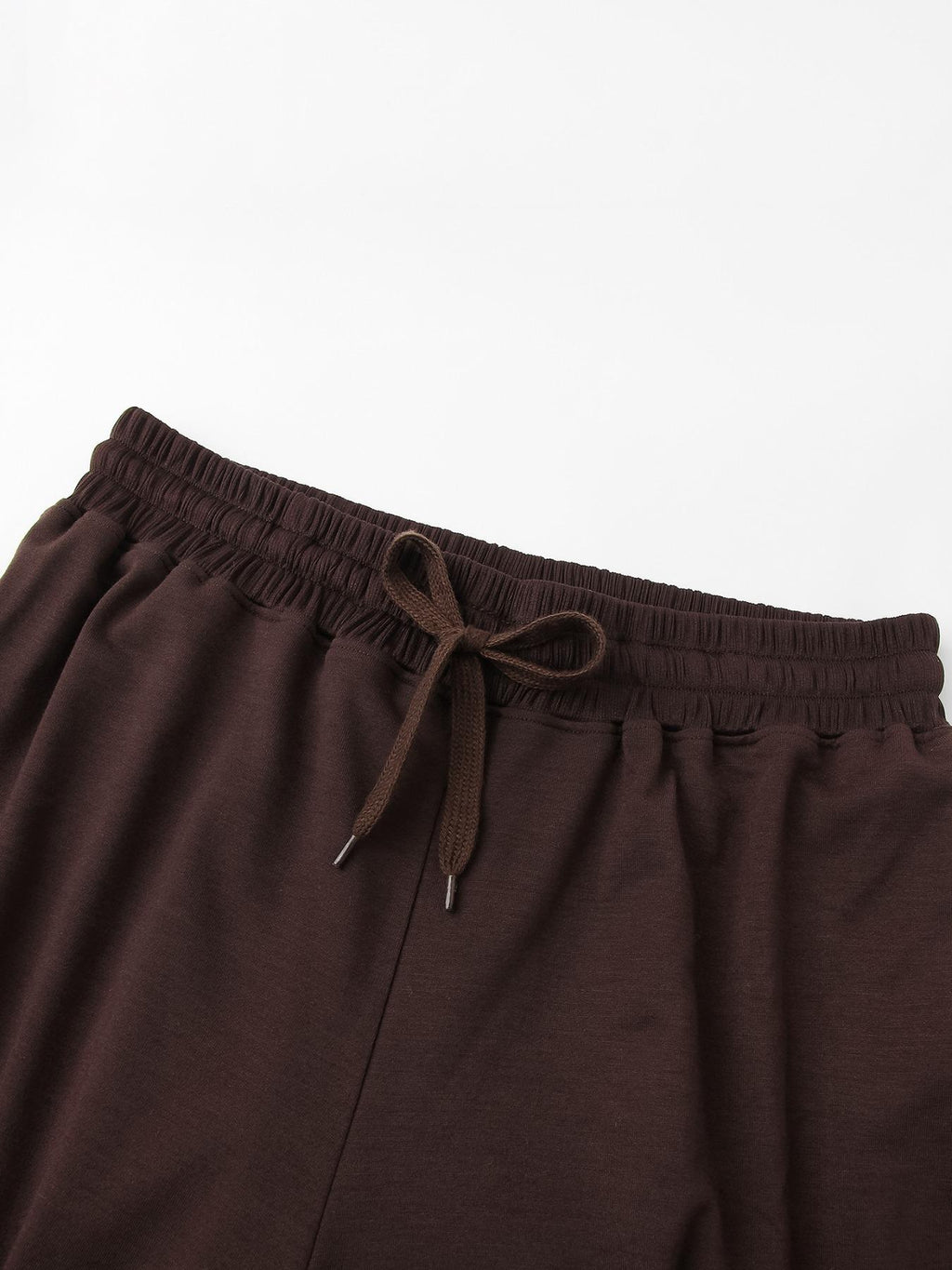 Detail of the elastic drawstring waistband on the wide-leg lounge pants