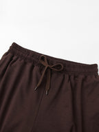 Detail of the elastic drawstring waistband on the wide-leg lounge pants