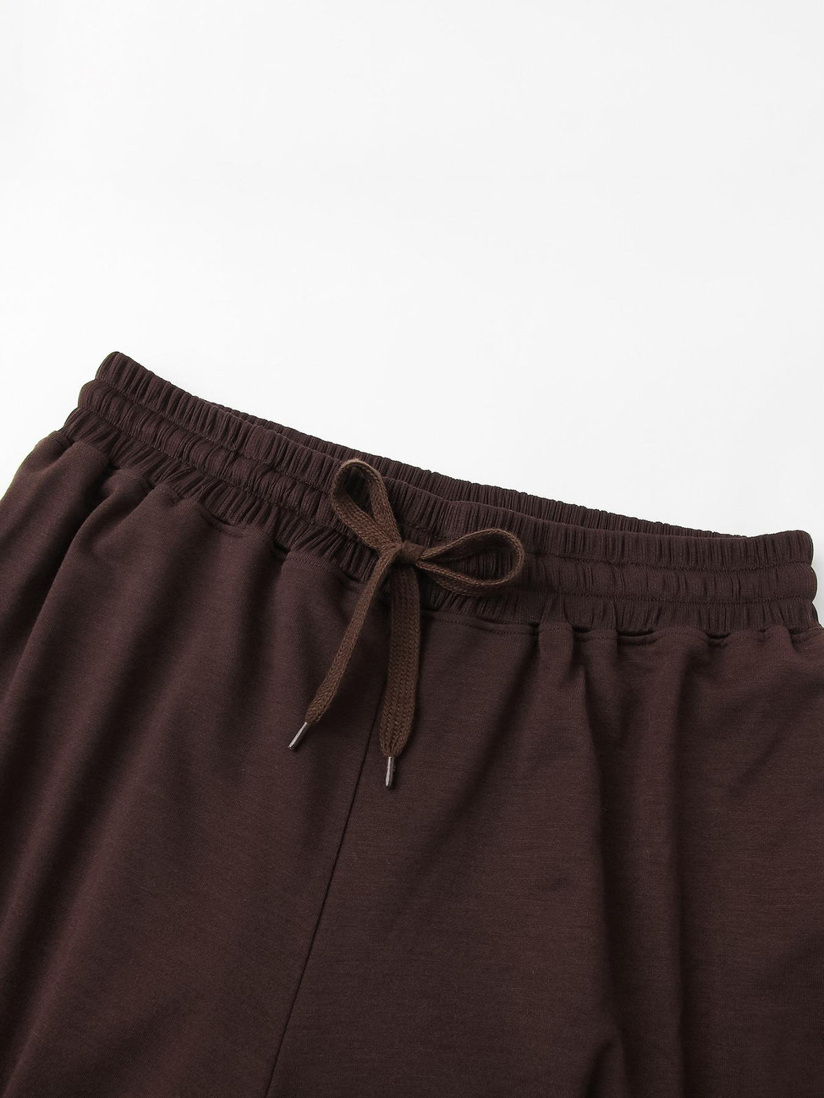 Detail of the elastic drawstring waistband on the wide-leg lounge pants