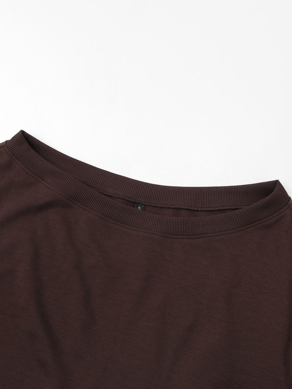 Close-up of the soft neckline on the off-shoulder sweatshirt