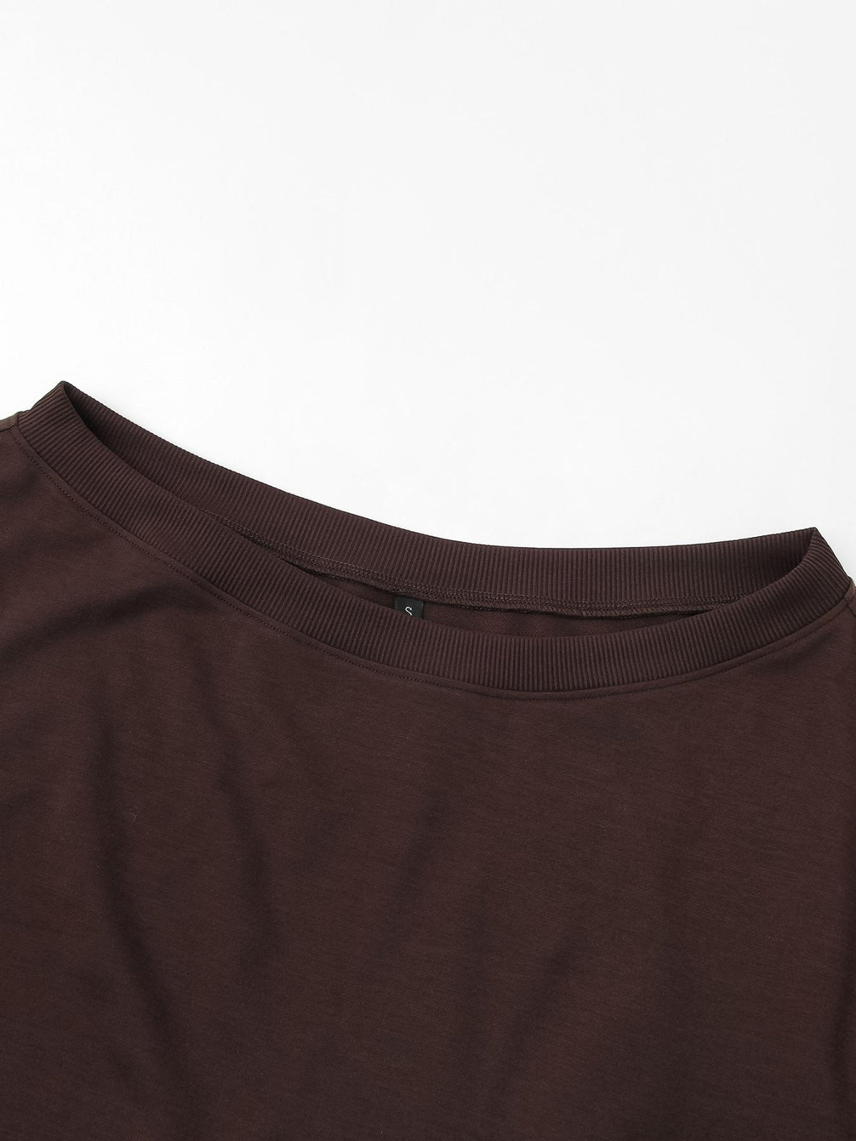 Close-up of the soft neckline on the off-shoulder sweatshirt