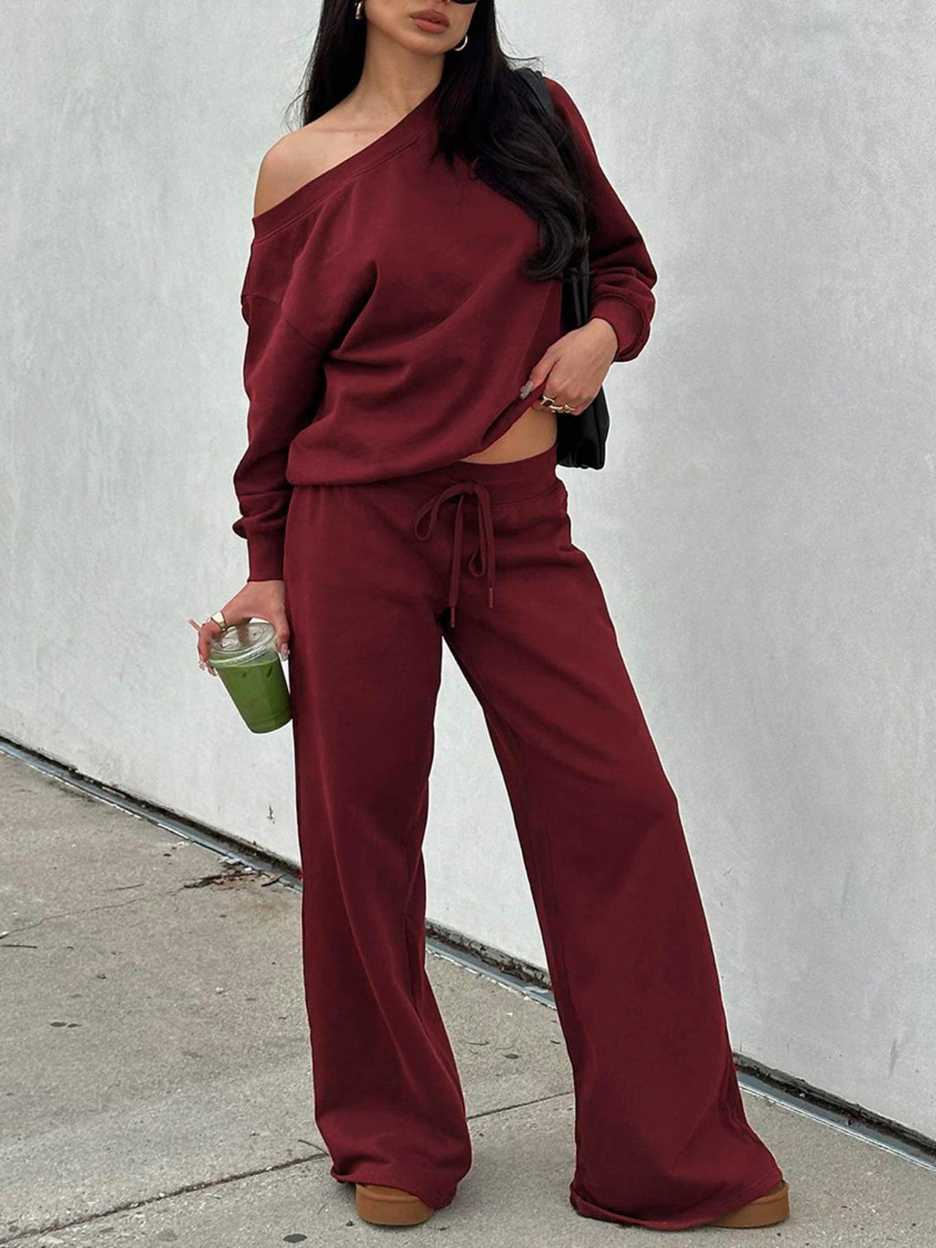 Woman in the red off-shoulder lounge set with wide-leg pants