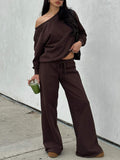 Woman wearing the coffee brown off-shoulder lounge set with wide-leg pants, front view