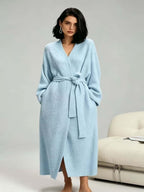 Woman in a light blue long plush robe