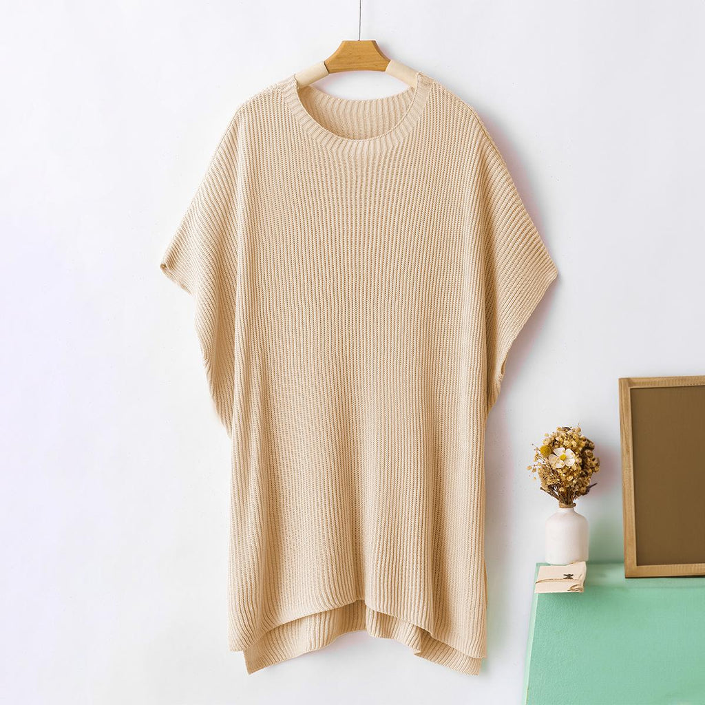 Beige oversized knit pullover on a hanger, front view