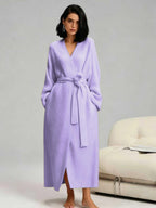 Woman in a mauve purple long fleece robe
