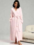 Woman in a soft pink long plush robe