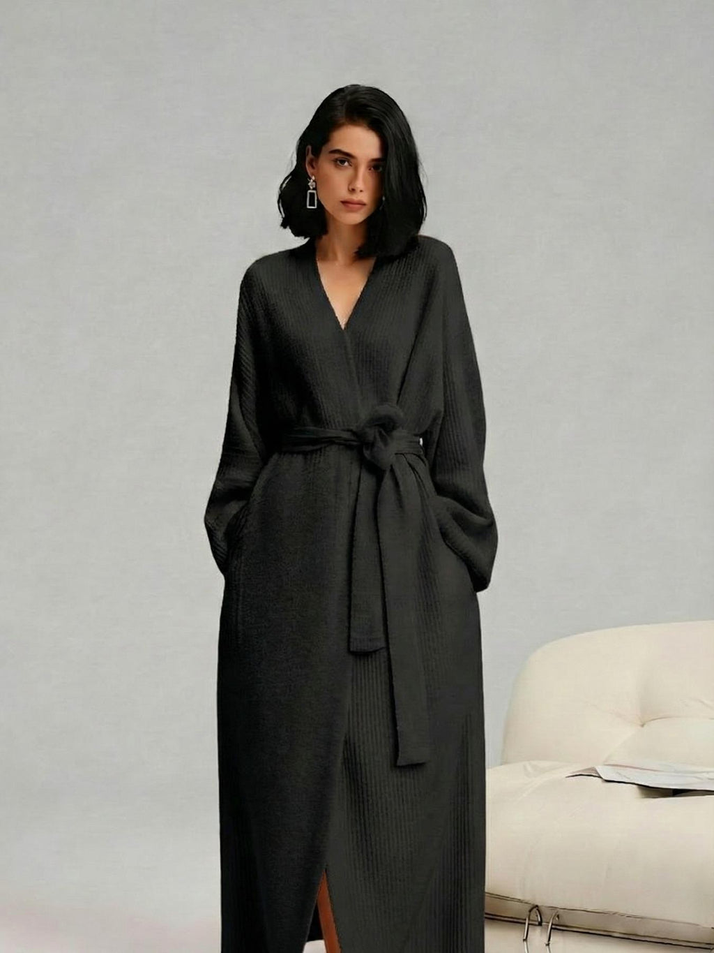 Woman in a black long fleece robe