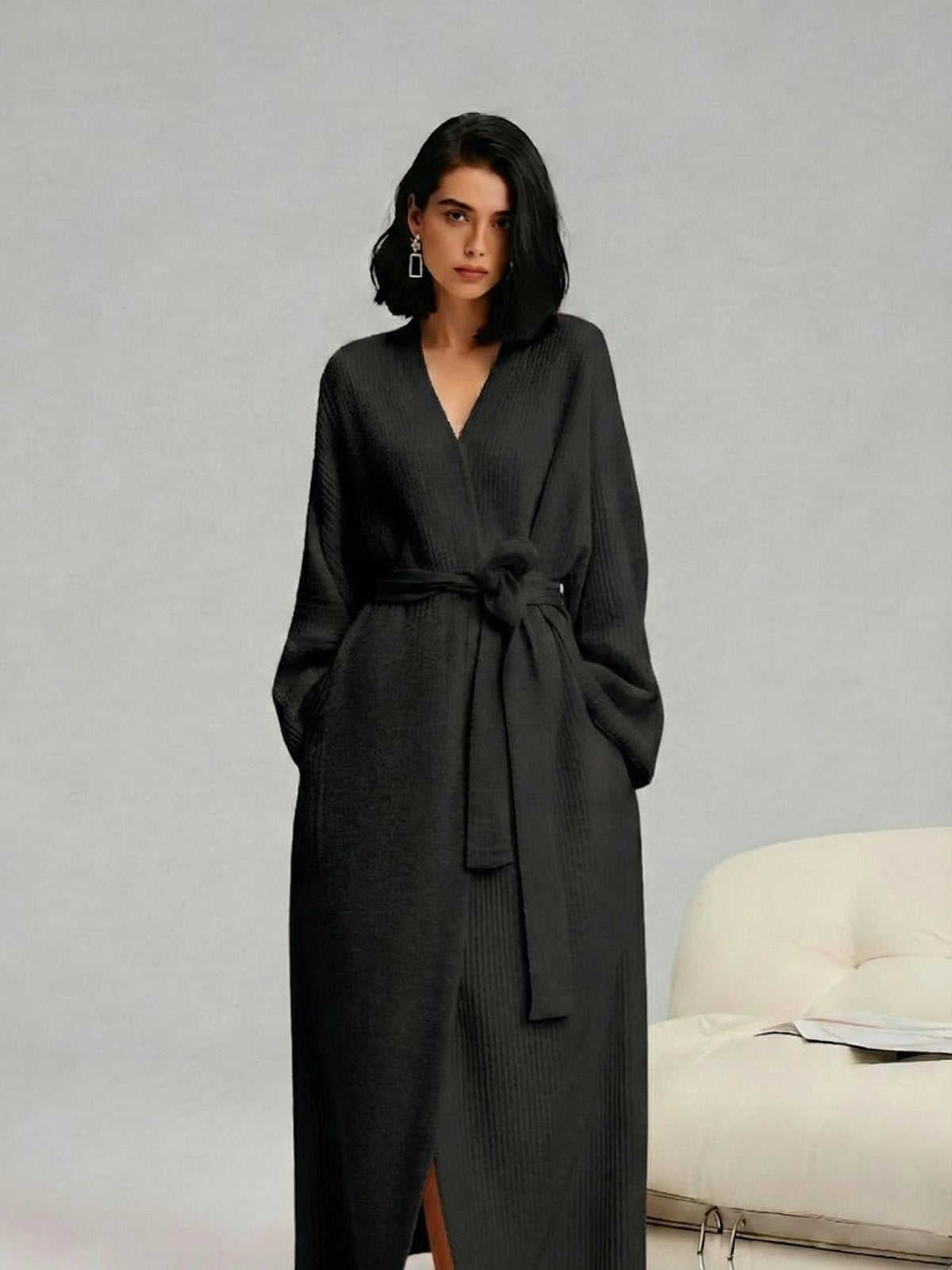 Woman in a black long fleece robe