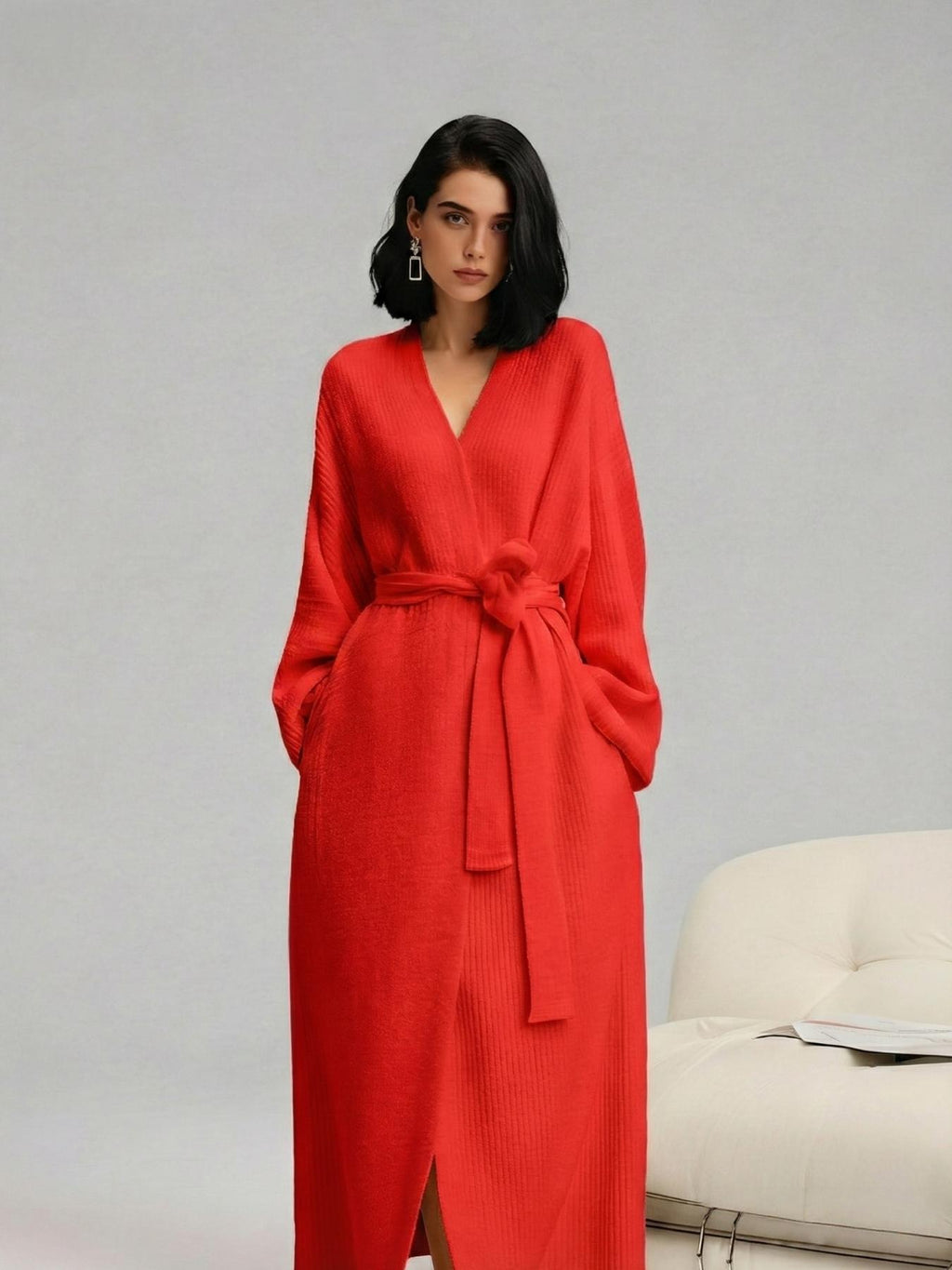 Woman in a red long plush robe with tie belt