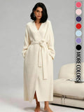 Woman in a cream long double-sided fleece robe with tie belt